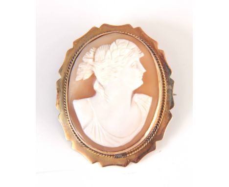 A 9CT GOLD MOUNTED CAMEO BROOCH portrait of a lady 44mm long 36mm wide, total weight app. 8.2g