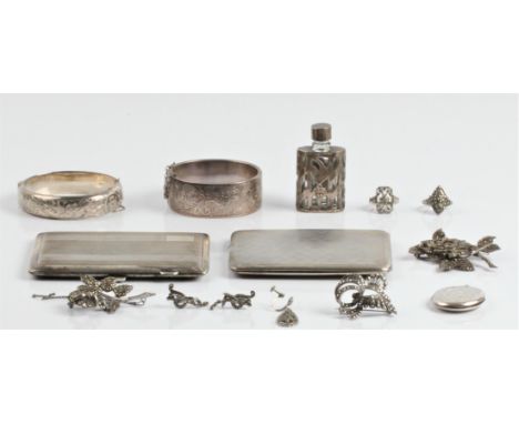 A collection of hallmarked silverware, to include a cigarette case, two hinged bangles and a locket, together with a collecti