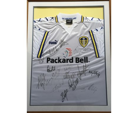 *A Leeds United FC Puma signed by team football shirt, in frame. IMPORTANT: Online viewing and bidding only. Collection by ap