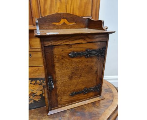 An oak single door smokers cabinet and an oak standard lamp IMPORTANT: Online viewing and bidding only. Collection by appoint