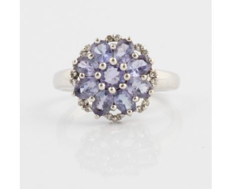 A tanzanite and diamond cluster ring, stamped 9k, ring size M.&nbsp;IMPORTANT: Online viewing and bidding only. No in person 