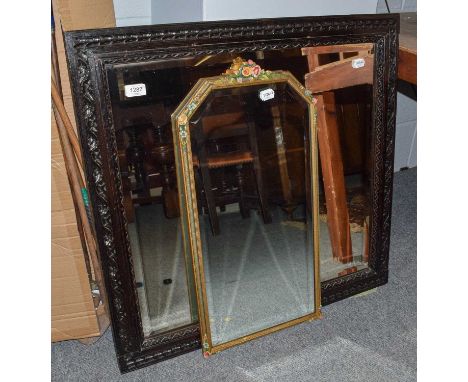 A carved oak framed wall mirror with bevelled glass; togther with a Barbola mirror with bevelled glass (2)