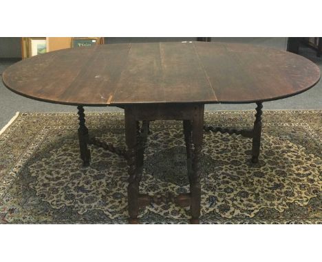 A 1920s oak gateleg dining table 190cm by 138cm by 77cm, a 19th-century mahogany tilt top tripod table, a mahogany demi-lune 