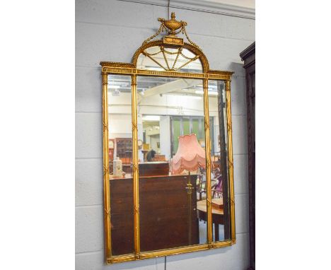 An early 20th century Adam's Revival gilt framed mirror with arched top and urn shaped pediments, 70cm by 123cm