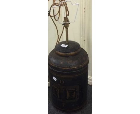 A toleware tea canister converted to a lamp, a painted metal coal-scuttle, two small Victorian cast iron stick stands and two