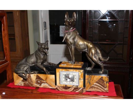 Striking marble and spelter mantel clock, surmounted by two German Shepherd dogs, in the Art Deco style