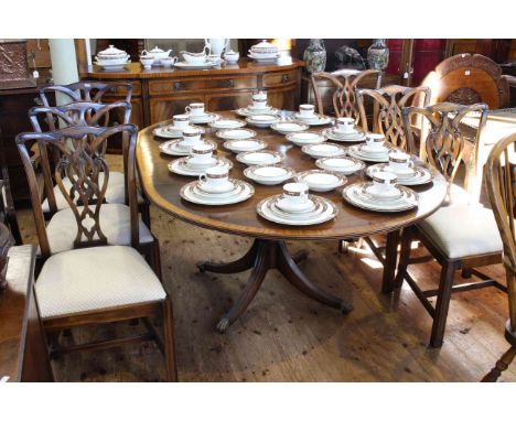 Rackstraw mahogany crossbanded shaped front sideboard, extending pedestal dining table and six Chippendale style chairs