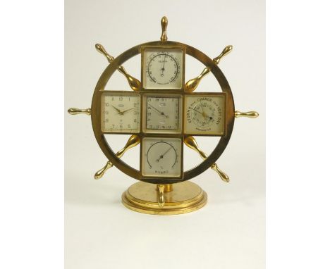 Angelus weather station clock, in the form of a brass ship's wheel on round stepped base, with five stations, thermometer, ca