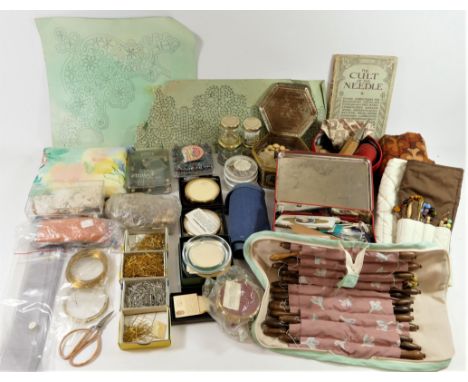 A collection of contemporary turned fruit and hardwood bobbins, many with spangles, together with other lace making tools 