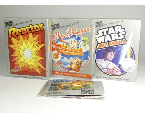 Three Atari 2600 games, published by Parker Video Games, including Star Wars Jedi Arena (original box, card insert, manual, A