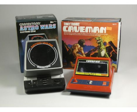 Two table top electronic games, Tomytronic Caveman (original box, polystyrene and card inserts and manual, together with a Gr
