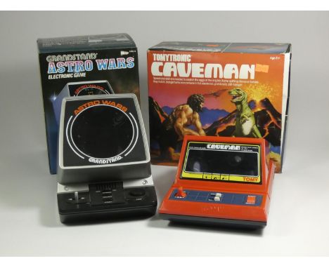 Two table top electronic games, Tomytronic Caveman (original box, polystyrene and card inserts and manual, together with a Gr