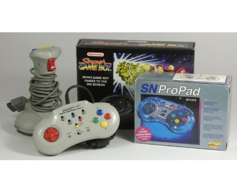 A Super Gameboy, original box and card insert, together with three third party controllers, a Tecnoplus, an SN ProPad and a T