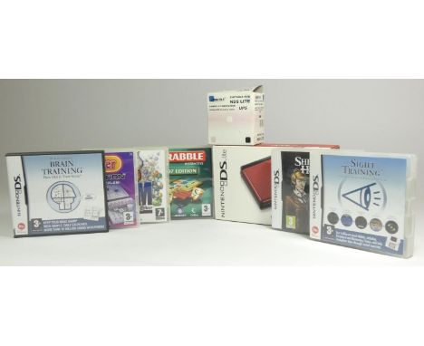 A Nintendo DS Lite, original box, instruction manual, Nintendo power booklet, registration form, health and safety booklet, P