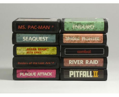 Ten Atari 2600 games, including Alpha Beam with Ernie (manual and Kids controller decal insert), Ms. Pac-Man (manual), Raider