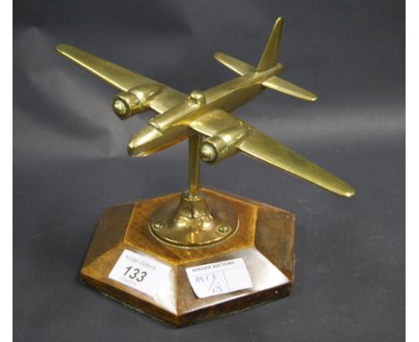 Brass desk paperweight of a vintage military aircraft