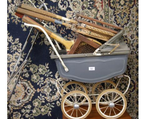 Vintage coach-built Tri-Ang doll's pram along with a good selection of vintage tennis rackets 