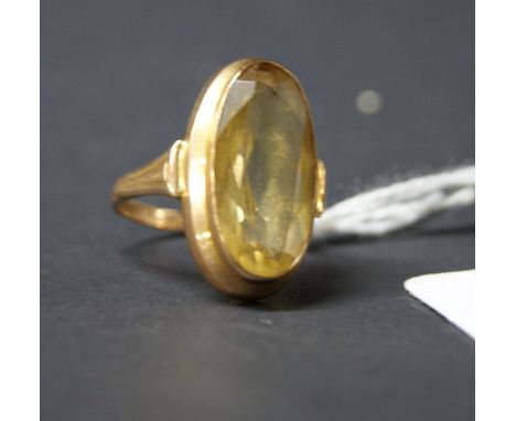 Gold ring with a central citrine stone