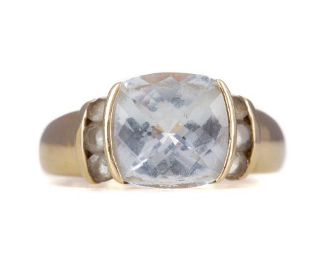 QUARTZ RING,set with a faceted light blue quartz with round stones to the shoulders, marked 14K, size O 1/2, 5g