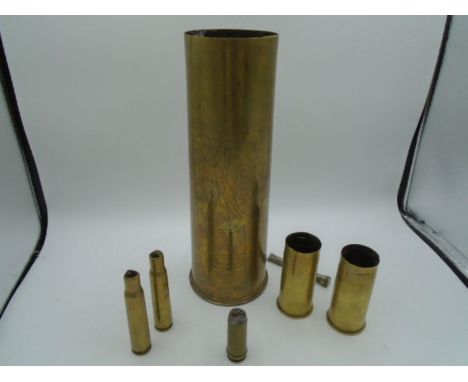 WWI 18 pounder brass shell case dated 1915 trench art, plus two dated 1918, and two others, and a WWI trench art Lighter a/f&