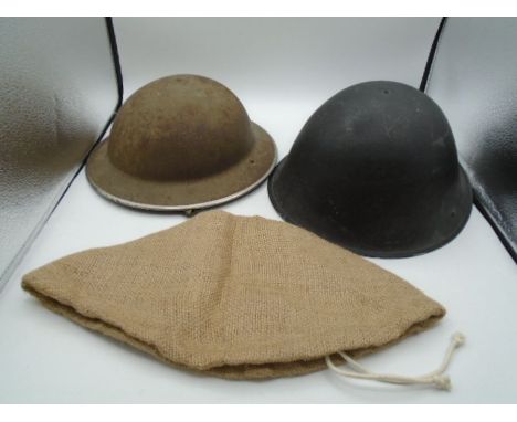 WW2 stamped 1941 mk.II Brodie helmet, plus a British mk. VI helmet C.1950's and a repro hessian helmet cover