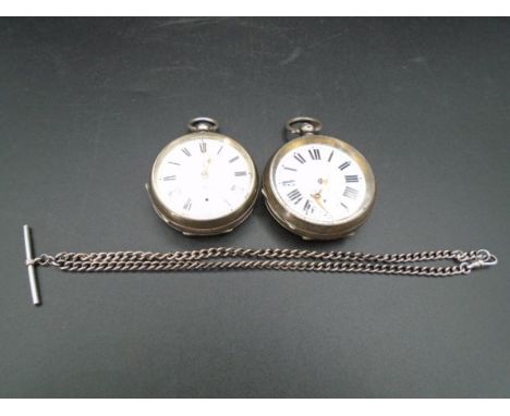 Two large silver hallmarked pocket watches - for spares or repairs plus a small silver Albert pocket watch chain 21cm approx.