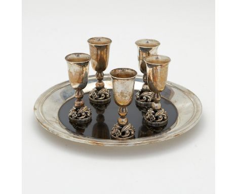 Set of five sterling silver cups and tray. Cups marked "Sterling 13925" along the interior of the footrim. Tray marked "Inter