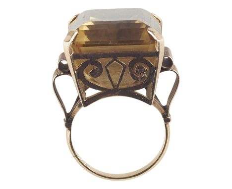 One women's 14K yellow gold citrine fashion ring. The ring is prong set with one emerald shape citrine of AA quality, measuri