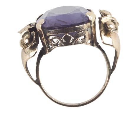 One women's fourteen karat rose gold synthetic alexandrite-like sapphire fashion ring. The ring is prong set with one oval sh