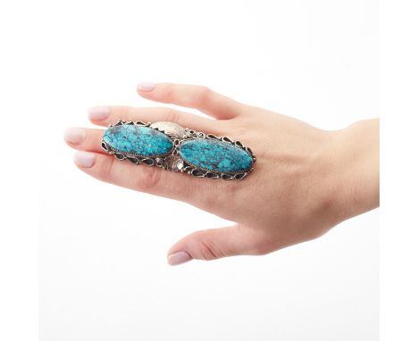 Navajo silver and turquoise ring, featuring two extremely large oval-shaped turquoise cabochons. The stones are set in silver