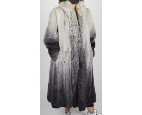 Mink fur coat with silver to black coloration. Monogramed on an interior patch "DFG." Tag reads "Made in England, fur origin.