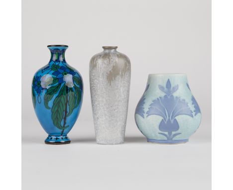 Group of three French art pottery vases. Two blue ceramic vases decorated with floral motifs. One ceramic vase with a high sh