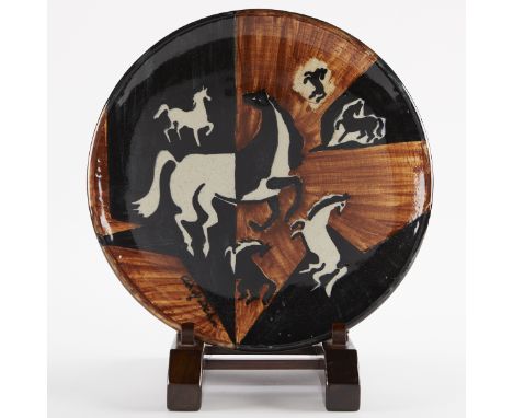 Adolf Dehn (American, 1895-1968). Ceramic plate glazed in black, brown, and white depicting prancing horses. Signed along the
