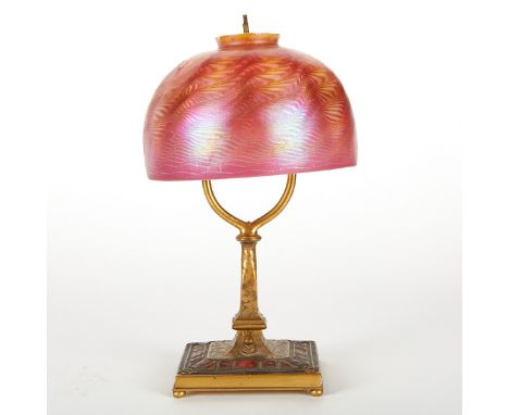 Louis C. Tiffany Furnaces, United States. Art Deco table lamp, ca. 1920-1924. Gilt metal base with enameled decoration, with 
