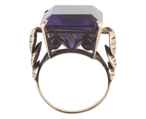 One women's 14K yellow gold amethyst fashion ring. The ring is prong set with one rectangular shaped amethyst of AA quality, 