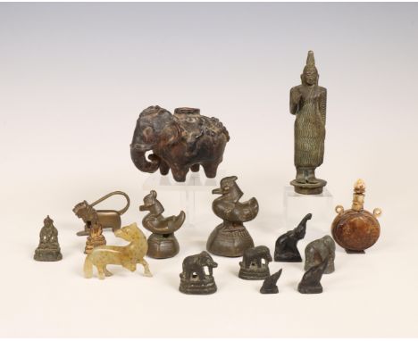 Southeast Asia, collection of bronze opium weights and Buddha figures, together with a jade animal, a ceramic elephant-shaped