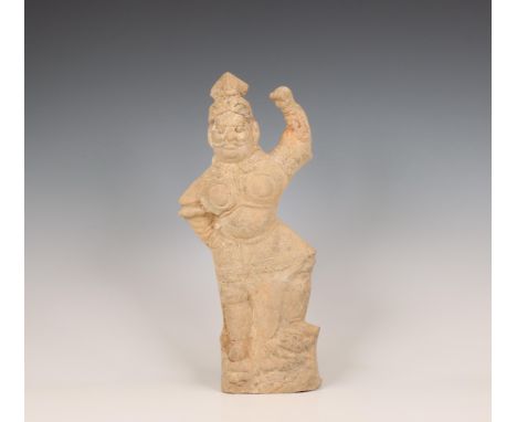 China, pottery model of a lokapala, probably Tang dynasty (618-906), wearing armour and trampling a beast beneath his feet, h