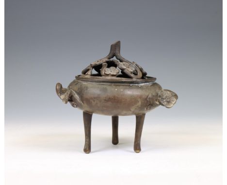 Japan, small bronze censer, 19th/ 20th century, of compressed circular form, raised on three tall legs, the handles and cover