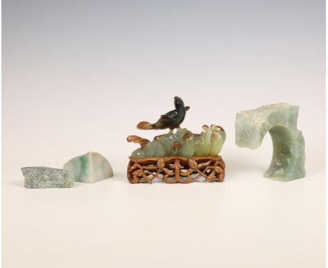 China, jade carving of a bird and three jade stones, late Qing dynasty (1644-1912), the carving shaped as a bird perched on r