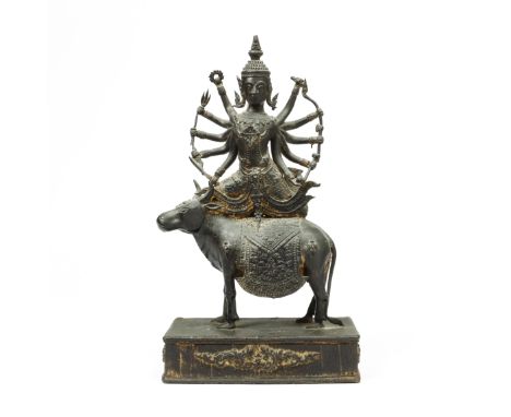 Thailand, Ratnakosin, a bronze seated Shiva on his bull, ca. 1900, with remnants of gilding. h. 34 cm. Provenance: Gallerie d