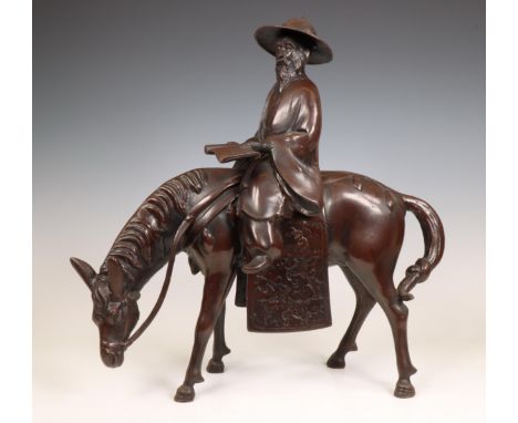 China, a bronze model of a scholar riding a horse, 20th century, the detachable figure shown straddled on a horse holding a s