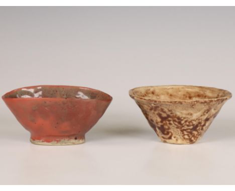 Japan, two ceramic chawan, modern, one covered with a pinkish red glaze and the other with a cream-brown glaze w. 11,2-12 cm 