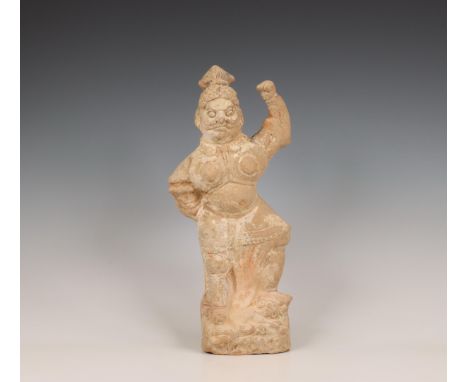 China, pottery model of a lokapala, probably Tang dynasty (618-906), wearing armour and trampling a beast beneath his feet, h