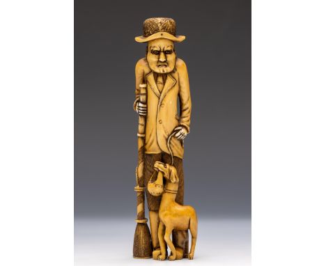 Japan, an ivory netsuke, ca. 1920, carved as a westerner dressed in western dress and hat and with a dog by his side, signed 