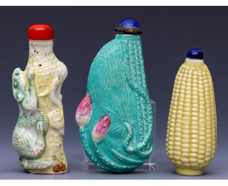 China, three moulded porcelain snuff bottles and stoppers, 19th/ 20th century, one shaped as an ear of corn, one as a lotus a