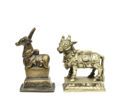 Noord-India, two bronze Nandi figures, 19th century; one seated on a high throne. h. 8 and 9,5 cm. Provenance Nandi on throne