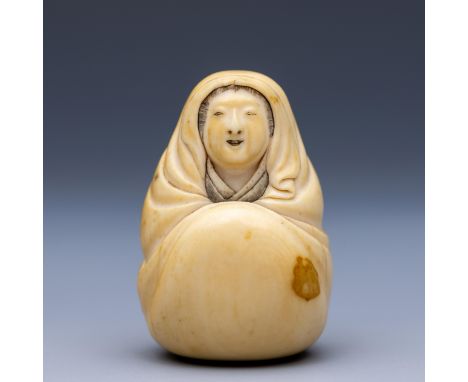 Japan, an ivory netsuke, Meiji period (1868-1912), 19th century, depicting Onna Daruma seated enveloped in robes, signed Koke
