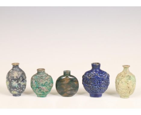 China, five various snuff bottles, one agate and four ceramic moulded with figures and animals (small damages and wear) h. 5,