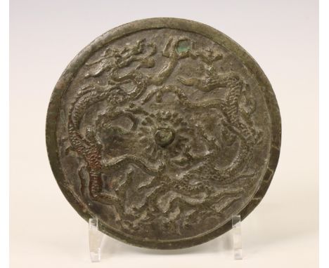 China, bronze 'dragon' mirror, probably Qing dynasty (1644-1912), cast with dragons and flaming pearls around the central kno