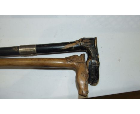 A 19th century carved ebonised wood Greek walking stick, the handle in the form of a horse's head with saddle and a moustache